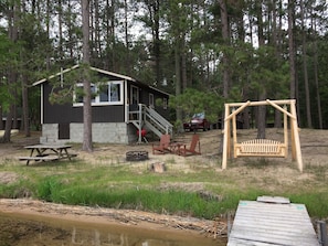 2 bedroom rustic (1930's) updated cottage on a sandy beach with dock space