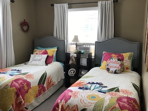 Front bedroom has 2 twin beds. Mattresses have fully sealed covers under linens.
