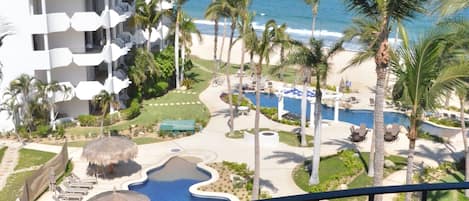 View from main balcony...over looking the pools and beach and ocean
