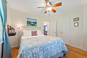 Another shot of the master bedroom with bedside bookshelf (and books :)!