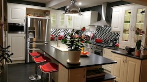 Newly refurbished kitchen with stainless steel appliances and granite countertop