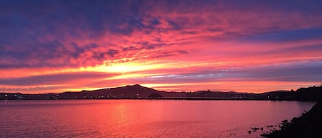 Sunset from your own deck - view all three bridges and the pelicans fishing!