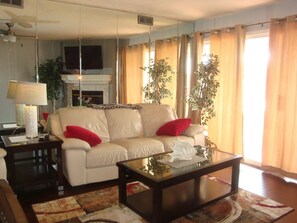 Leather furniture. Walkout to screened deck.