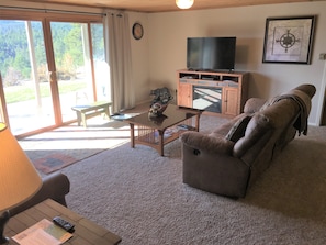 Relax in the Living Room with new comfortable furniture and fireplace.
