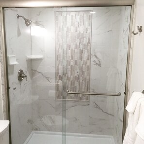 Heavy glass spa inspired shower doors.