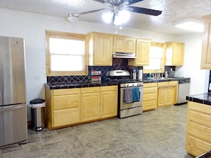 Kitchen with new stove and dishwasher