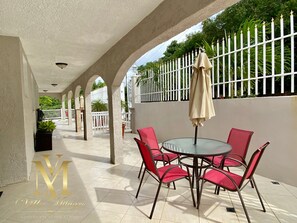 Extended front porch to villa entrance.