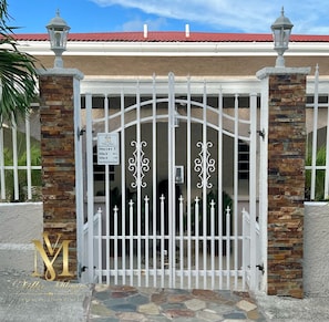 Front entrance gate with keyless entry.