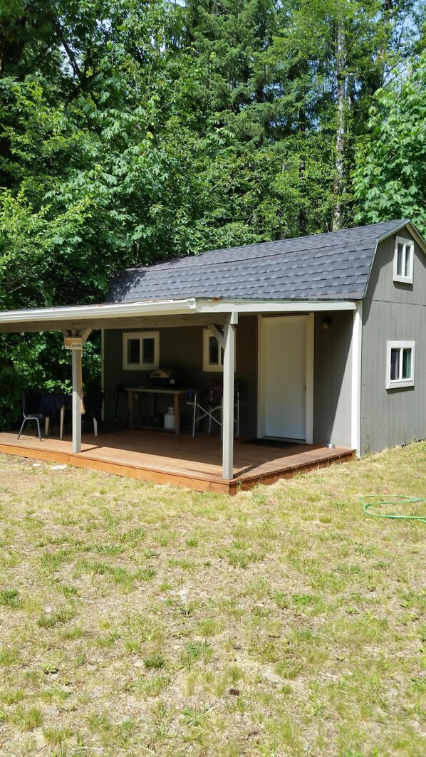 Deck with BBQ table and chairs