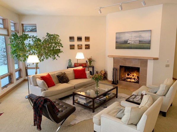 Living Room with Wood Burning Fireplace.