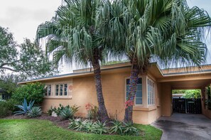 Twin Sisters palm trees and carport for your small car, plenty of driveway space