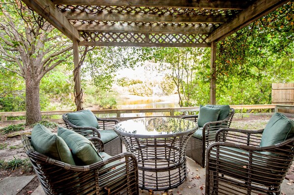 The patio facing the private pond brings ultimate relaxation