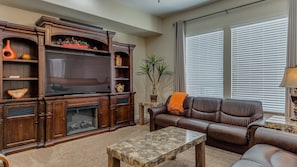 Family room featuring leather couches and extra blankets