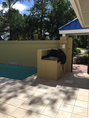 Looking out towards the entrance door is a beautiful built in Viking gas grill.