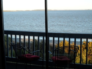 Watch Dolphins from your deck. Photo taken from inside condo.