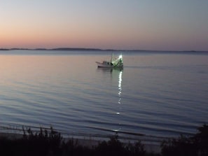 Shrimp boat at sunset, your balcony view.