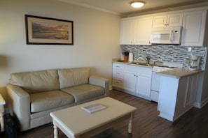 Cozy living area looks out to the water.