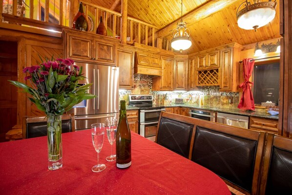 Enjoy a glass of wine in the dining area while looking out at the mountains.