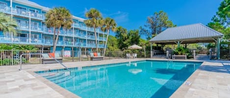 Pool with the condo in the background.