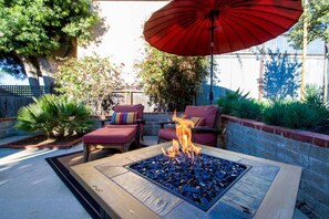 Private patio with hammock and fire-pit