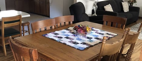 Open dining area flows to living room and kitchen