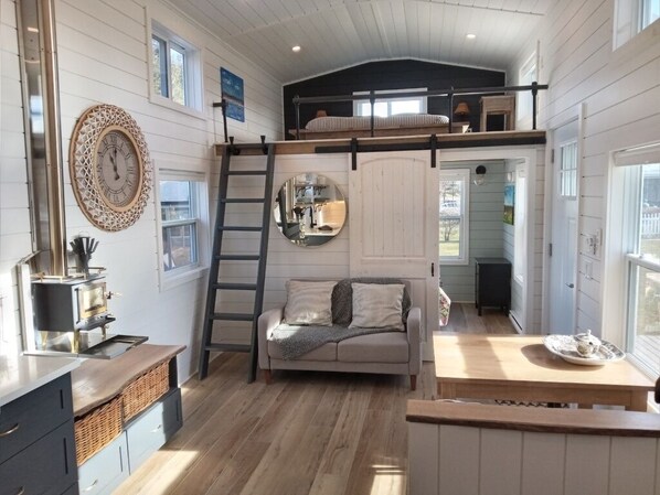 Living Area with wood stove and master bedroom access