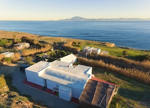 Aerial view of the house with Africa in background