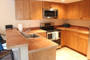 Kitchen: Oven/stove, microwave, toaster, coffee maker