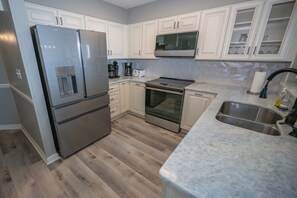 Brand new kitchen with new floors, ceiling, new appliances, new cabinets, marble