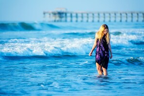 LOOKING FOR SEASHELLS AND ENJOYING THE FRESH COOL OCEAN. 