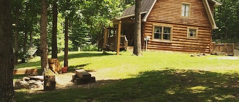 Front yard with fire pit & swing 