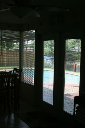 A Look out the Florida Room  to Pool and Canal