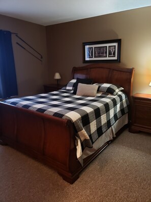 Comfortable queen size bed in master bedroom