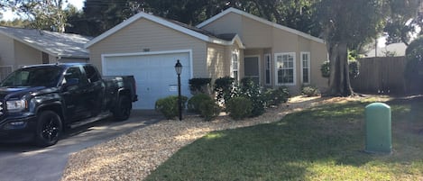 Front entrance, driveway and garden.