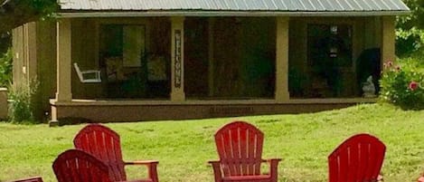 Sunny days at the cottage enjoy shade on the porch.