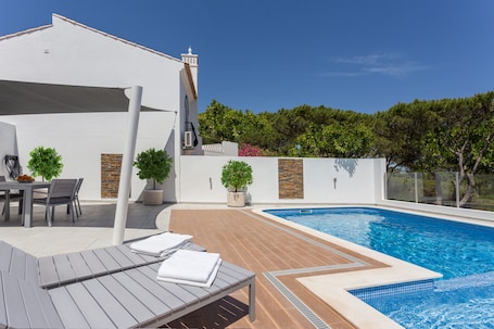 Large patio and heated private pool with kids section