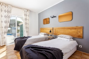 Bedroom 2 downstairs with access to outside via sliding doors (children's lock)