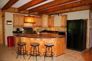 Fully furnished kitchen has everything you need to cook meals at the cabin.