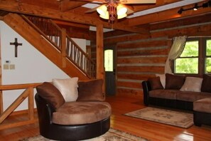 Plenty of comfy seating in the great room.Everyone loves the round swivel chair!