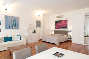 the living room with the king-size bed on a corner