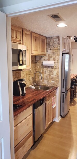 Kitchen now has dishwasher, micro-convection oven, full fridge, stove top