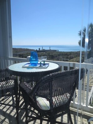 One of 2 table/ chairs sets on deck 