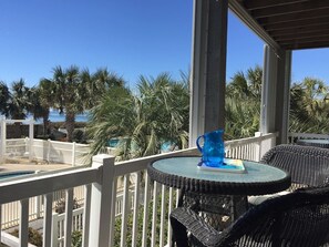Second table on deck facing kiddie pool 