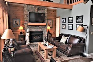 Living Room, featuring Stack Stone Fireplace with gas logs !