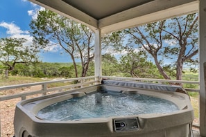 Enjoy the hot tub while overlooking the beautiful hill country views