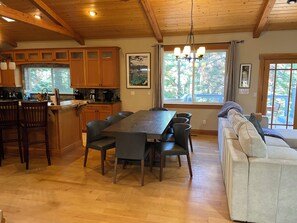 Dining room Table seats 8, with bar stool seating at bar.