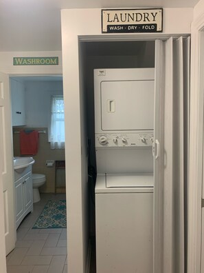 Newly added stackable laundry by the bedrooms, new tile and fresh linens. 