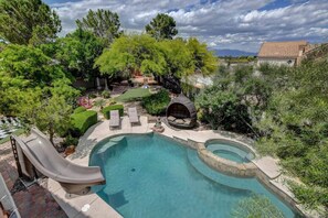 Experience resort-style luxury with a pool, waterslide, hot tub, mini golf, and steam sauna. The perfect escape for fun, relaxation, and indulgence