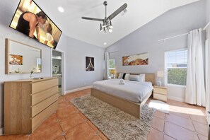 Master suite with a plush king bed and 50” HD Smart TV. Relax, recharge, and wake up refreshed in comfort and style.