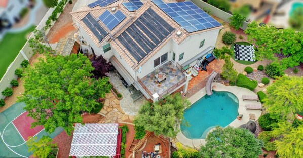 Your private Summerlin retreat awaits. Enjoy mini golf, a heated pool (with fee), hot tub, and steam sauna. Stay active in the gym with a Peloton bike, relax in the hammock garden, or fire up the BBQ and smoker. Dine outdoors and explore Tivoli Village ju